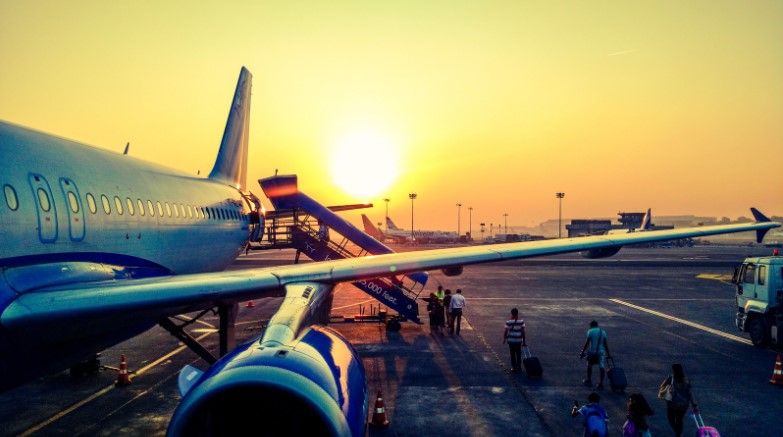 passengers boarding a commercial airplane